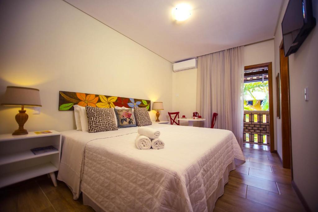 Cama ou camas em um quarto em Pousada Dom Capudi