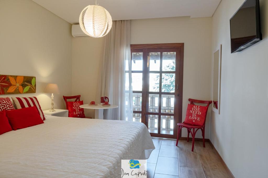 Cama ou camas em um quarto em Pousada Dom Capudi