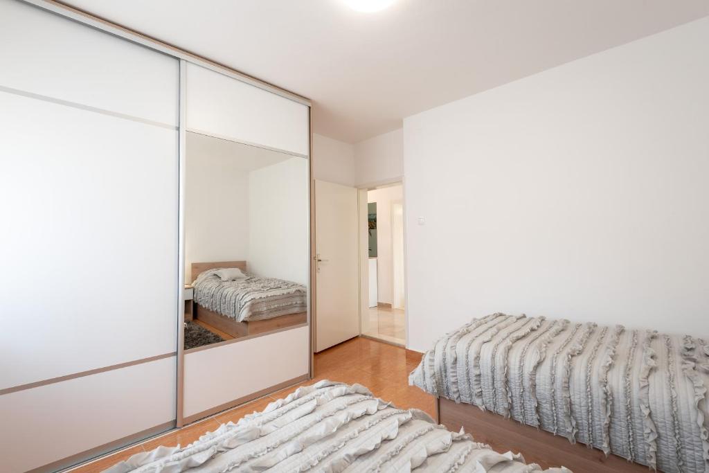 Postel nebo postele na pokoji v ubytování Apartman Galov