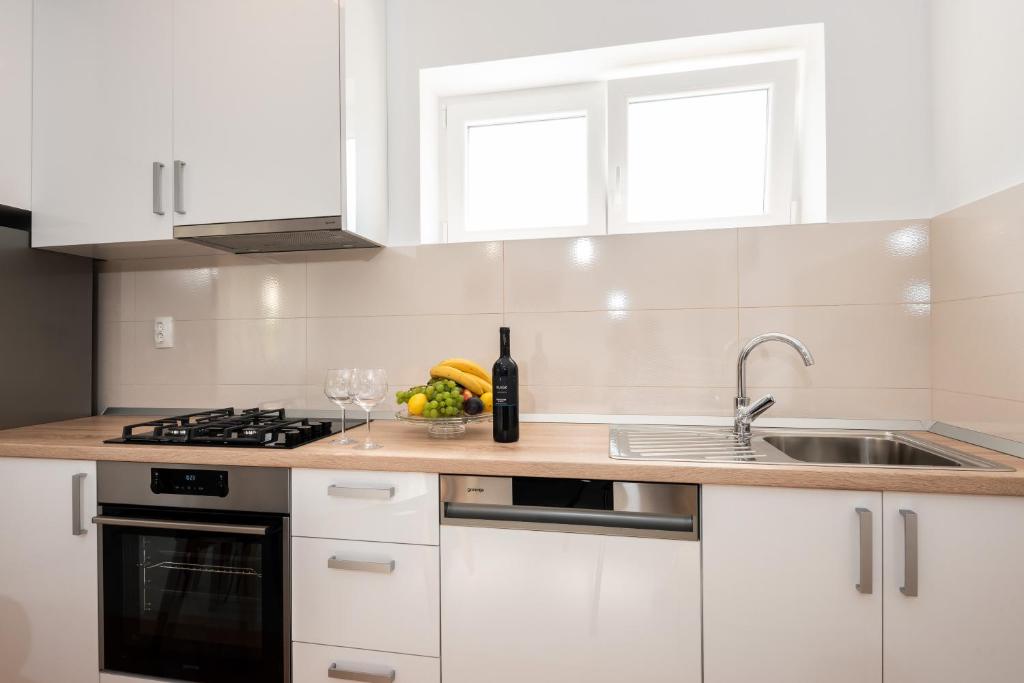 Kuchyň nebo kuchyňský kout v ubytování Apartman Galov