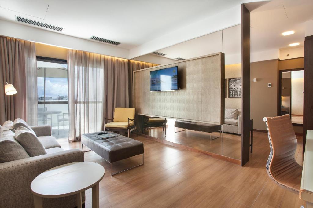 TV a/nebo společenská místnost v ubytování Wish Hotel da Bahia