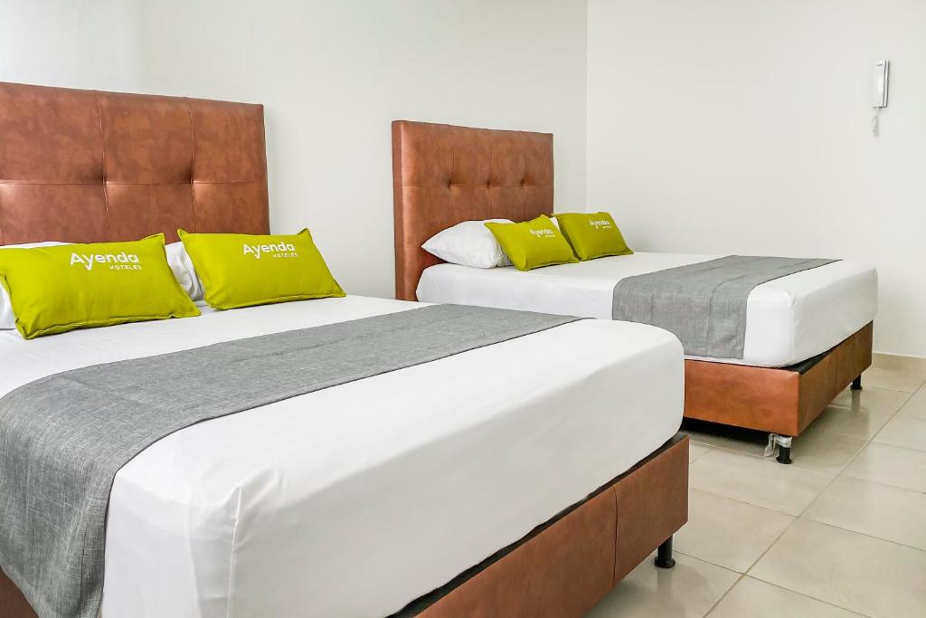 Postel nebo postele na pokoji v ubytování Ayenda 1138 Apartahotel 109