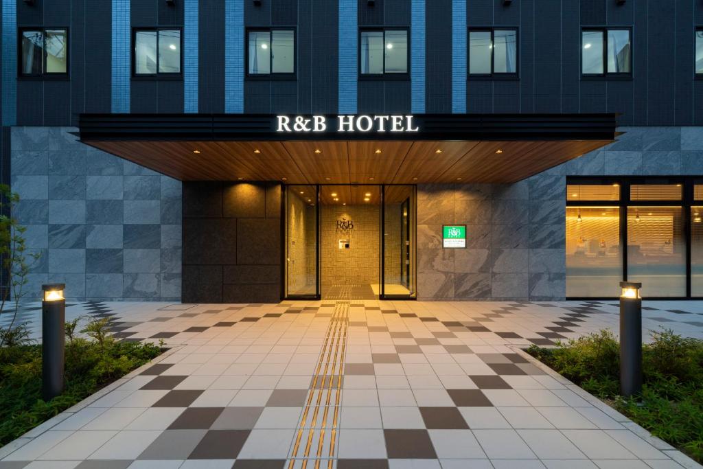 an entrance to a hotel with a checkered floor at Washington R&B Hotel Nagoya Shinkansenguchi in Nagoya