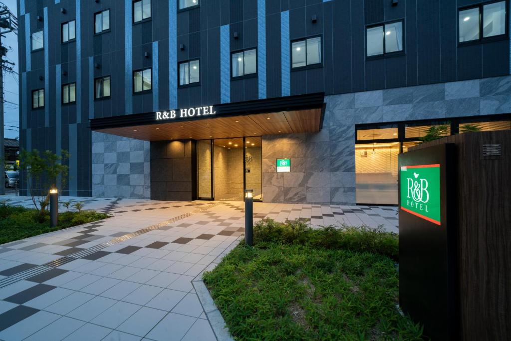 a building with a sign that reads new hotel at Washington R&B Hotel Nagoya Shinkansenguchi in Nagoya