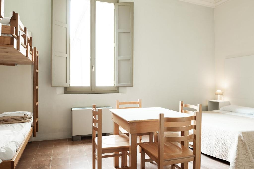 Postel nebo postele na pokoji v ubytování Antico Convento San Francesco