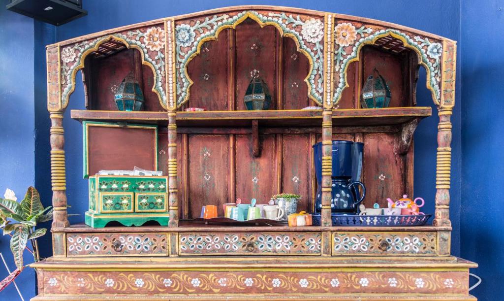 a wooden cabinet with items on top of it at Residencial Terra de Mar, Grupo Terra de Mar, alojamientos con encanto in Calpe