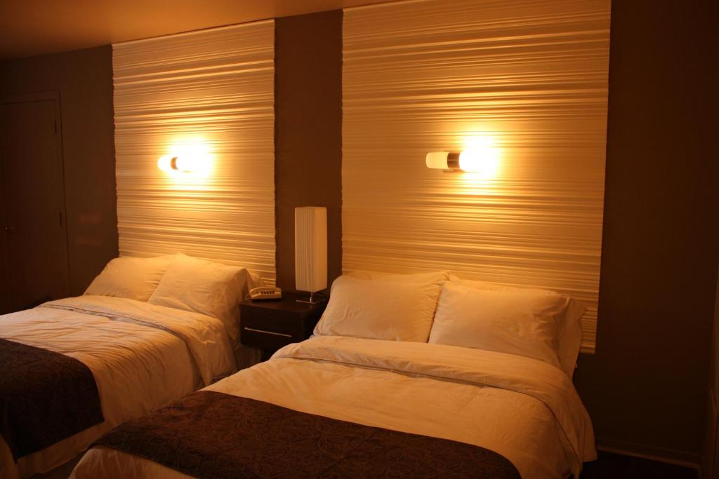 Postel nebo postele na pokoji v ubytování Motel Fraser