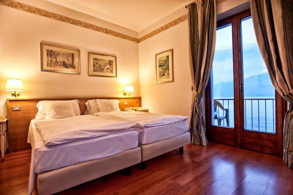 Postel nebo postele na pokoji v ubytování La Caletta Hotel Bolognese
