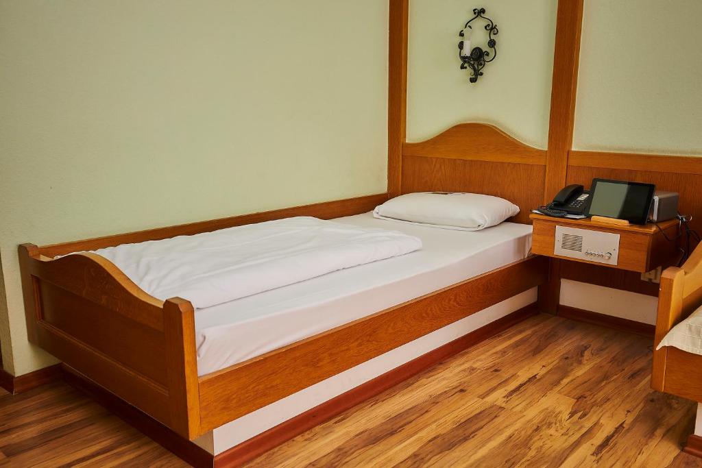 Postel nebo postele na pokoji v ubytování Flair-Hotel Zum Benediktiner