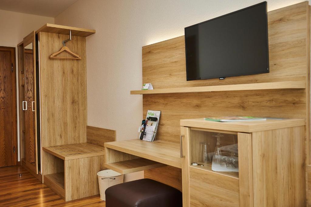 TV a/nebo společenská místnost v ubytování Flair-Hotel Zum Benediktiner