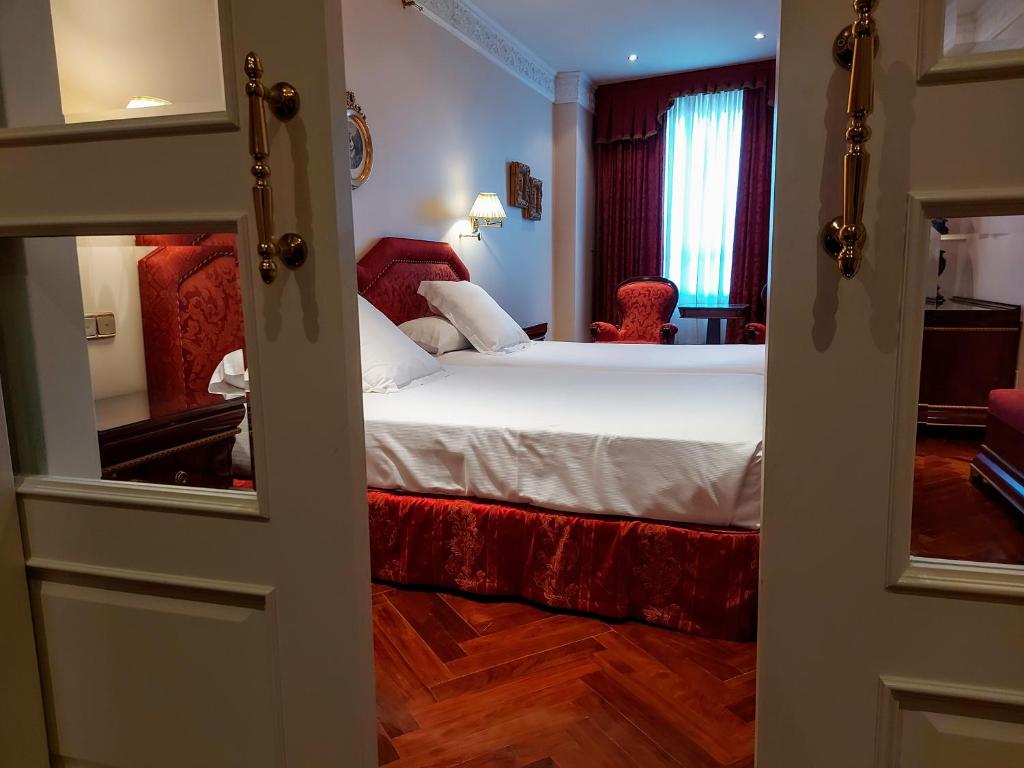 Postel nebo postele na pokoji v ubytování Hotel Alameda Palace