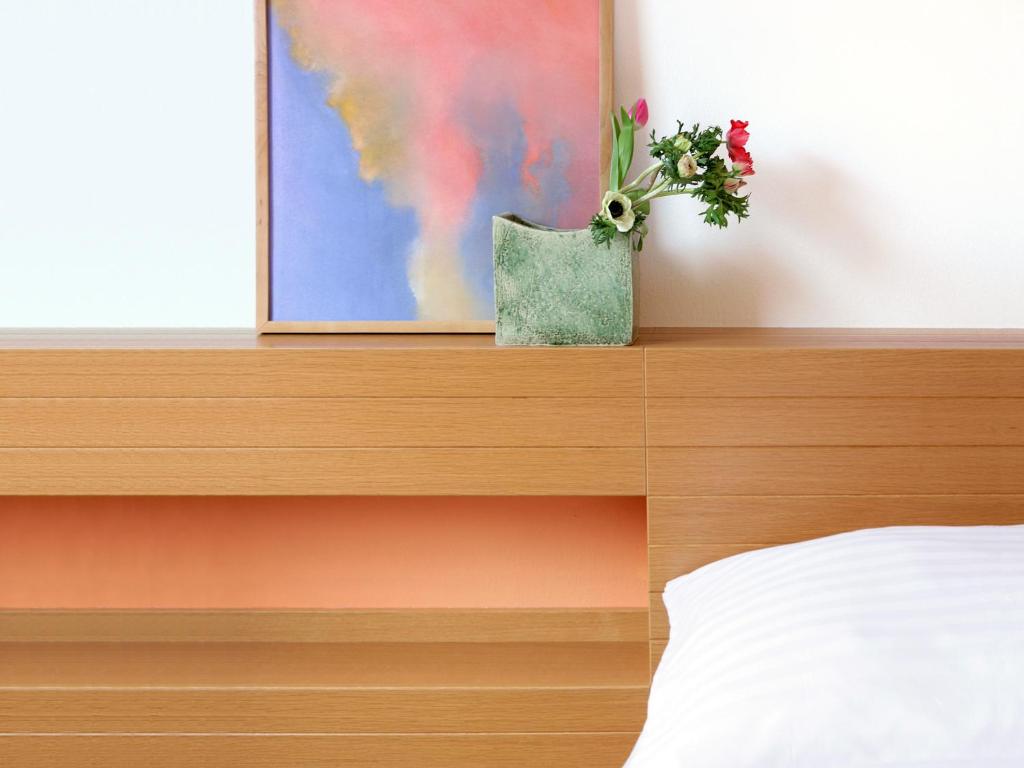 Postel nebo postele na pokoji v ubytování 1st Creatif Hotel Elephant