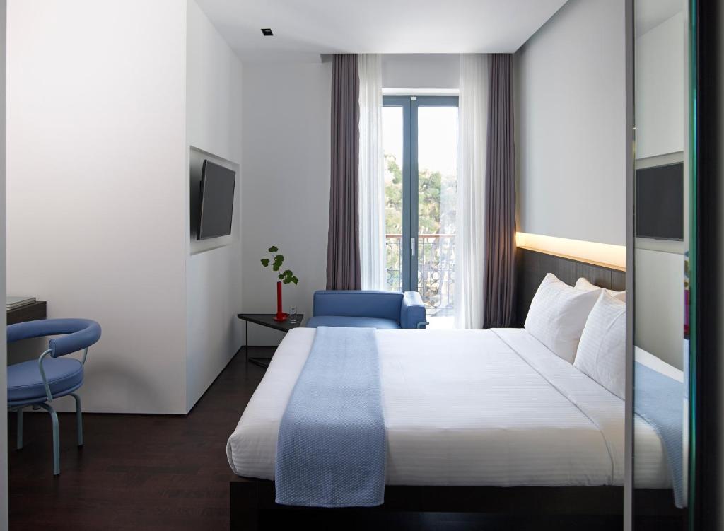 Postel nebo postele na pokoji v ubytování Domotel Kastri