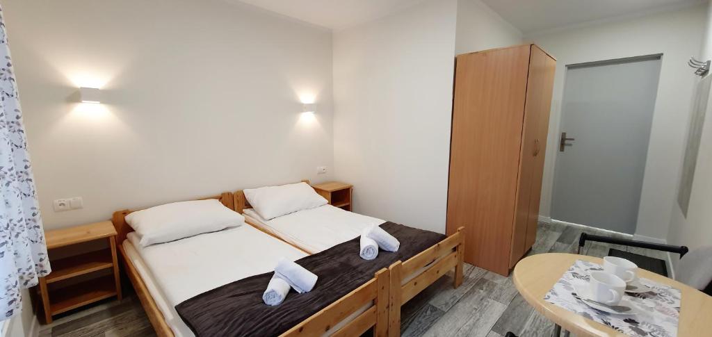 Posteľ alebo postele v izbe v ubytovaní Apartament, Pokoje Koniczynka