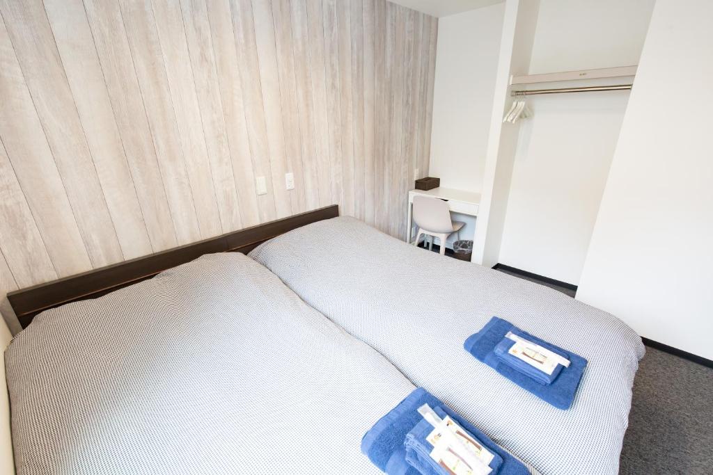 Postel nebo postele na pokoji v ubytování Port House Hatsudai
