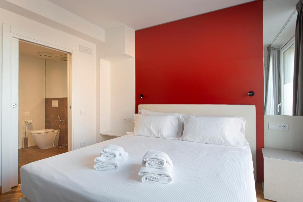 Postel nebo postele na pokoji v ubytování Padova Suites C20