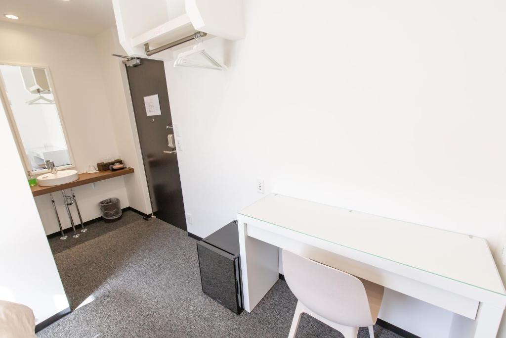 Kuchyň nebo kuchyňský kout v ubytování Port House Hatsudai