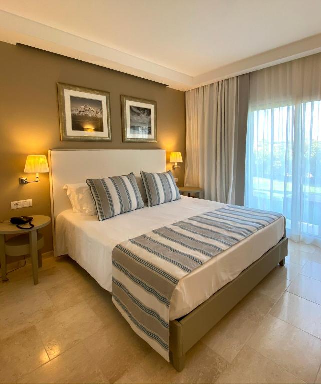 Posteľ alebo postele v izbe v ubytovaní Grand Hotel Cannigione
