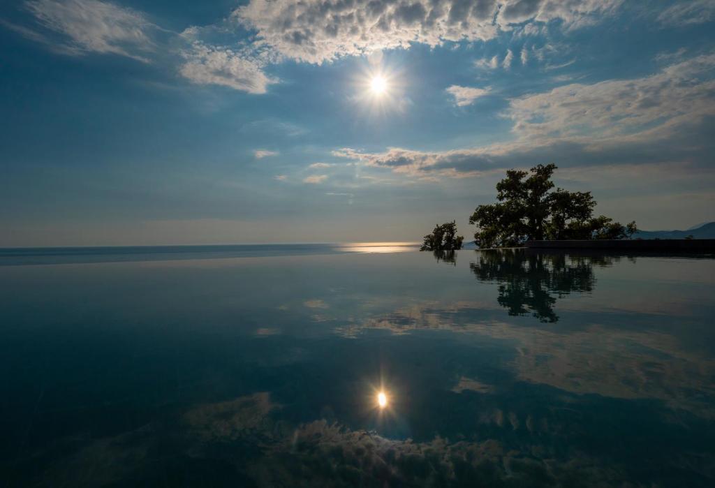 a view of a large body of water at Vivid Blue Serenity Resort in Sveti Stefan