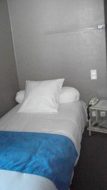 Postel nebo postele na pokoji v ubytování Hotel Du Port