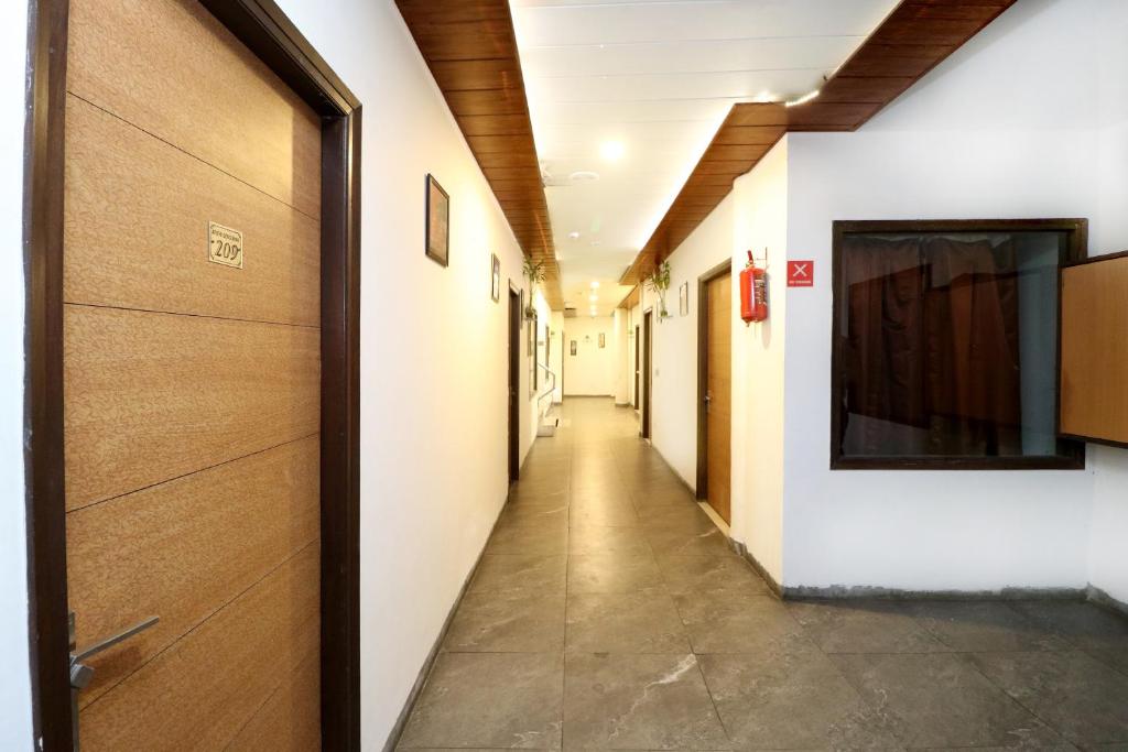 a hallway in a hospital with a hallway sidx sidx at Hotel Seven- Center of City Chandigarh in Chandīgarh