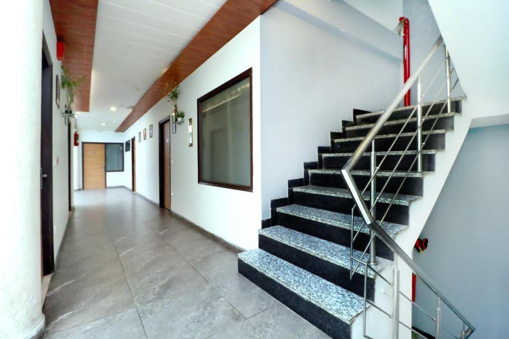 a hallway of a building with a staircase at Hotel Seven- Center of City Chandigarh in Chandīgarh