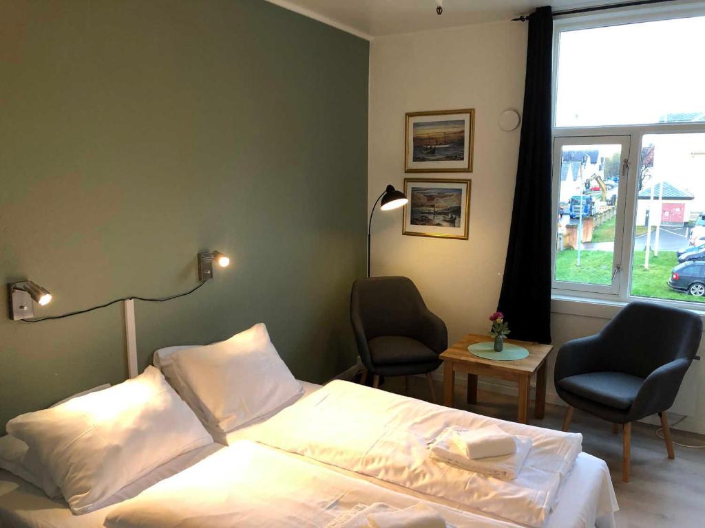 Postel nebo postele na pokoji v ubytování Ami Hotel