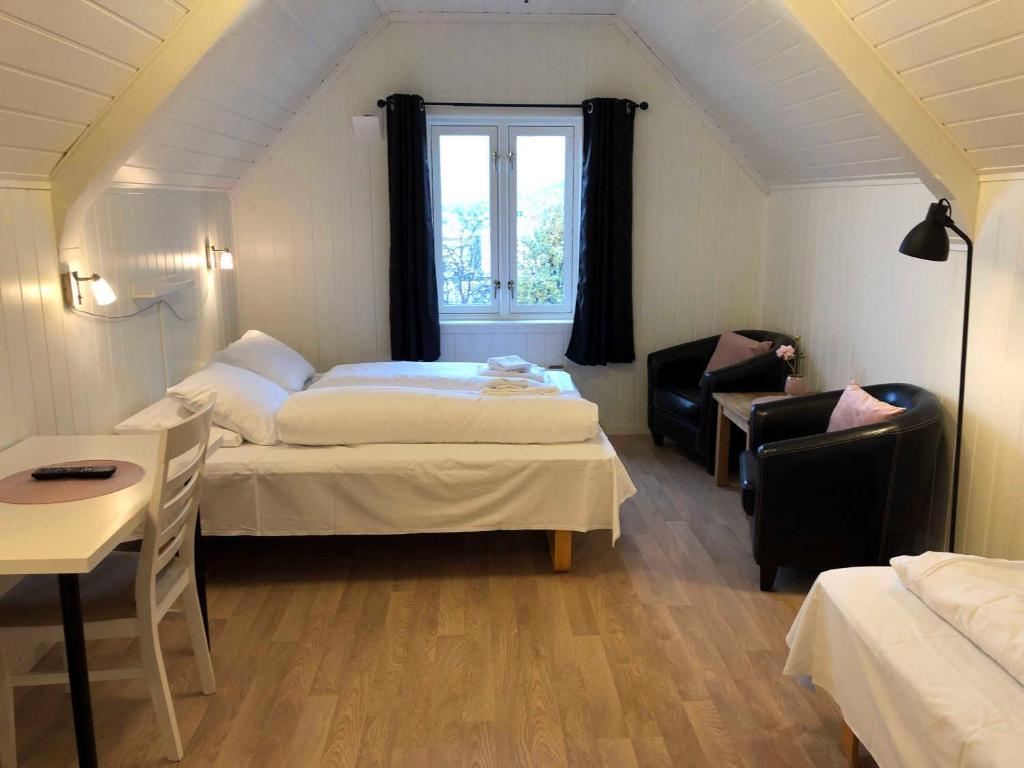 Postel nebo postele na pokoji v ubytování Ami Hotel