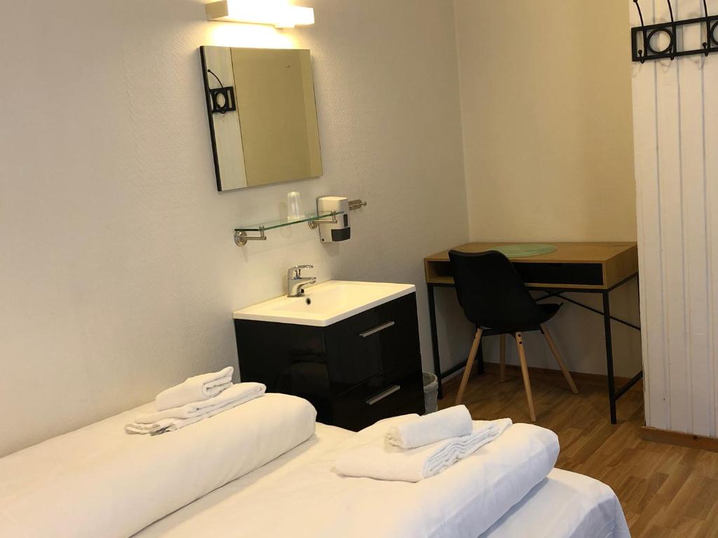Postel nebo postele na pokoji v ubytování Ami Hotel