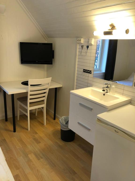 TV a/nebo společenská místnost v ubytování Ami Hotel
