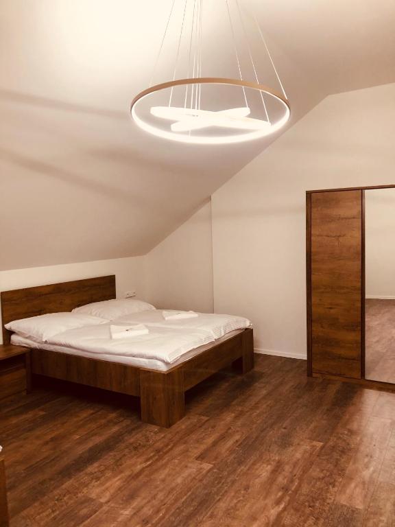 Postel nebo postele na pokoji v ubytování Penzion a Restaurace v Zátiší