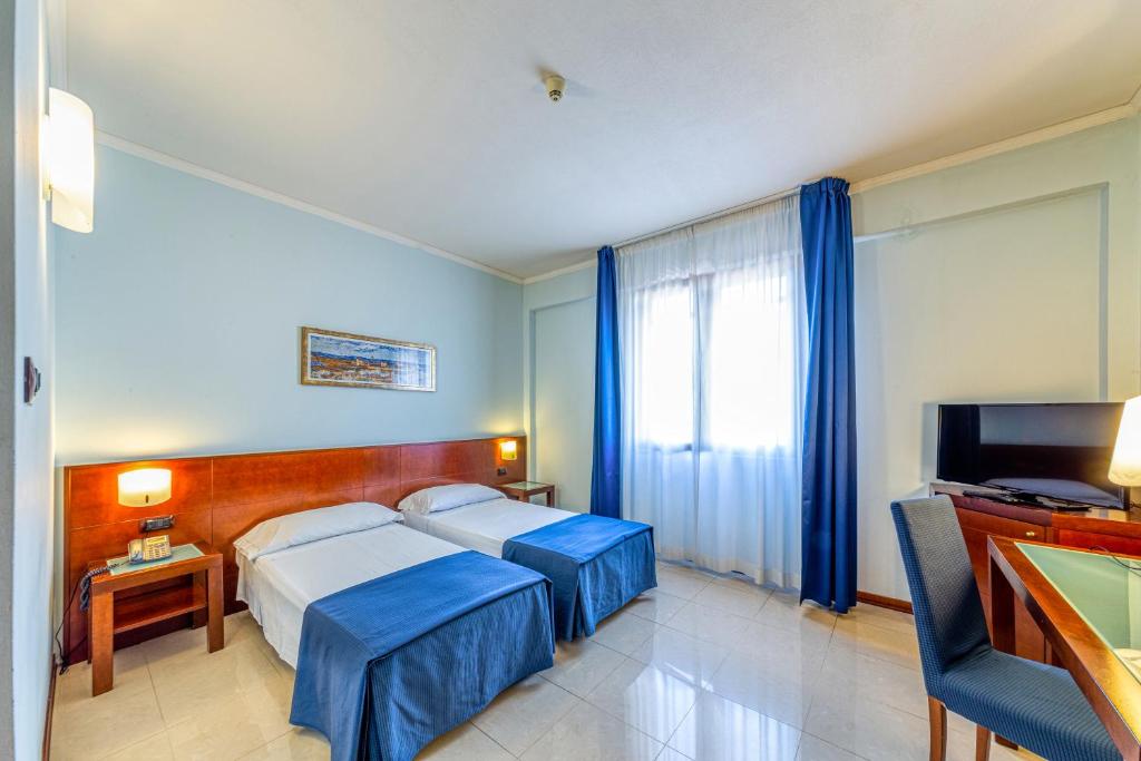 Posteľ alebo postele v izbe v ubytovaní Hotel Le Torri