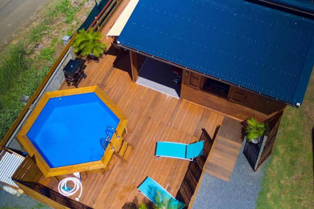 an overhead view of a house with a swimming pool at Noubana Au Coeur Des Cannes Avec Piscine Chauffée in Lamentin