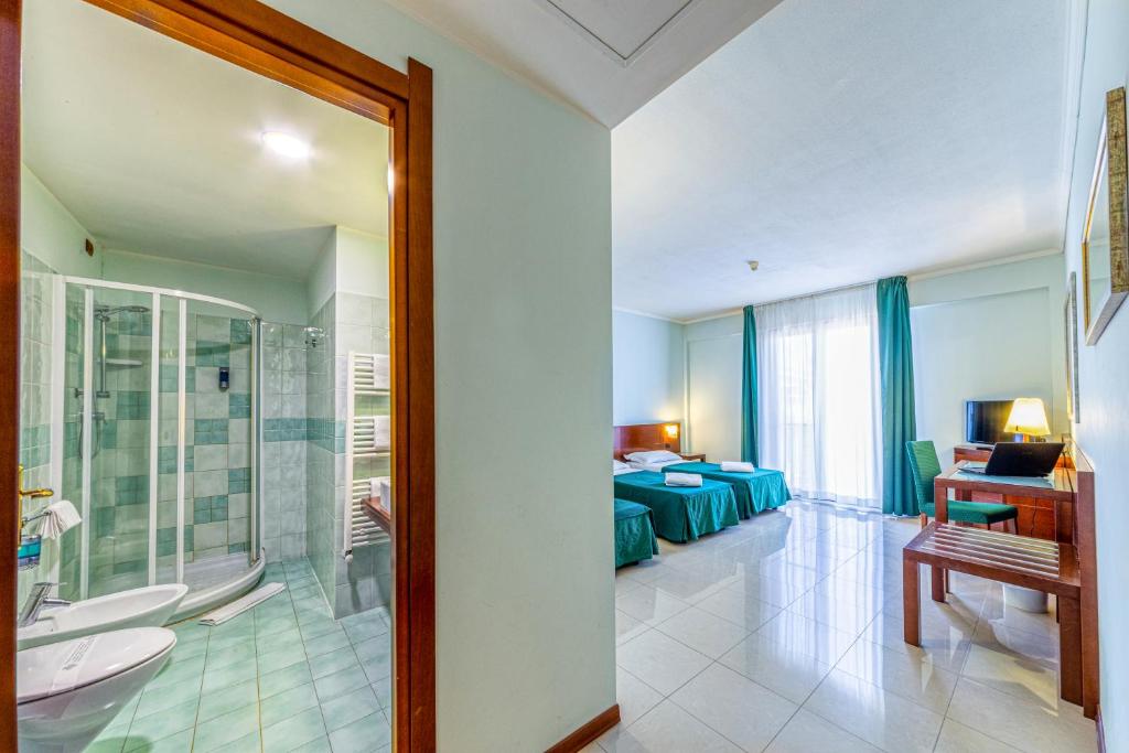 Posteľ alebo postele v izbe v ubytovaní Hotel Le Torri