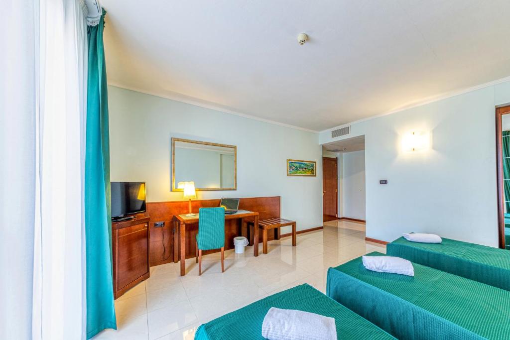Posteľ alebo postele v izbe v ubytovaní Hotel Le Torri
