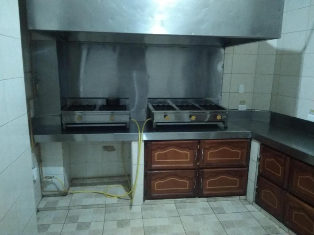 Kuchyň nebo kuchyňský kout v ubytování Hostal Buenos Aires