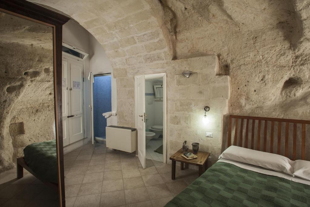 A bed or beds in a room at Residence San Pietro Barisano