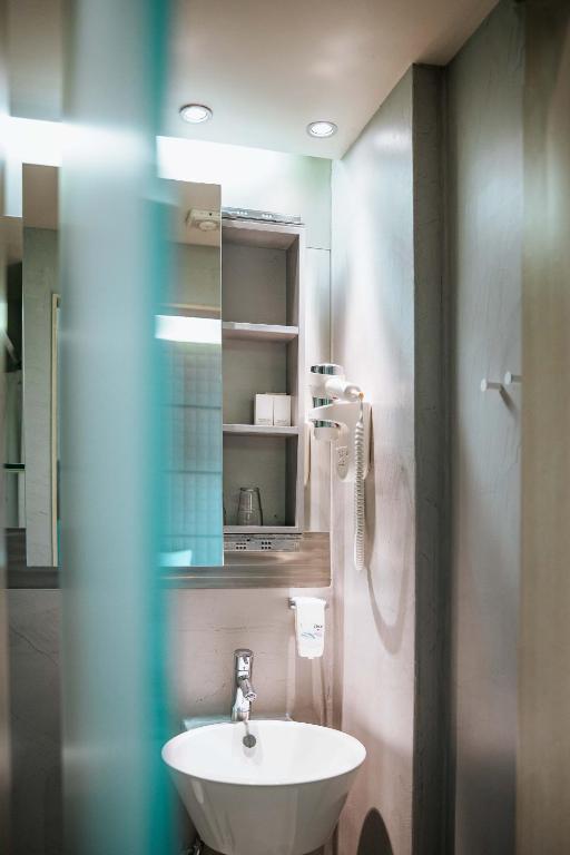 Koupelna v ubytování Domotel Olympia