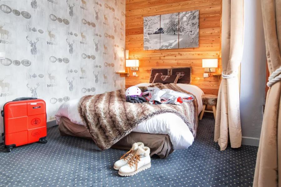 Postel nebo postele na pokoji v ubytování ALPINA LODGE VANOISE ex hotel du soleil