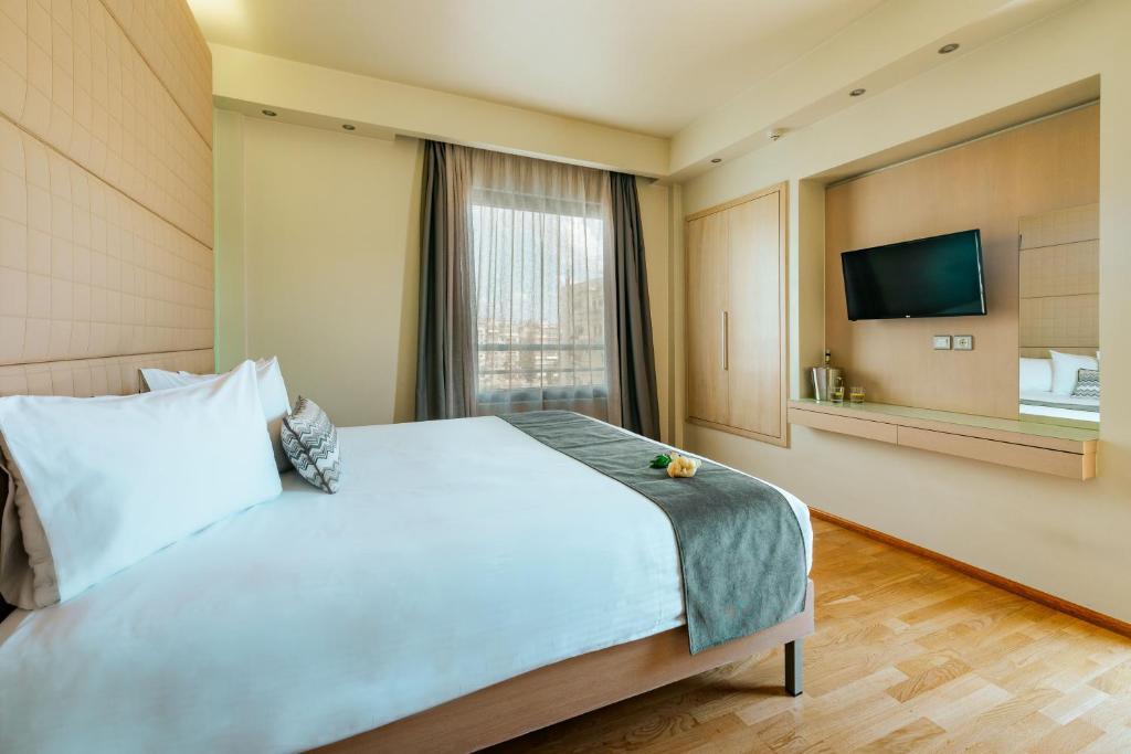 Postel nebo postele na pokoji v ubytování Domotel Olympia