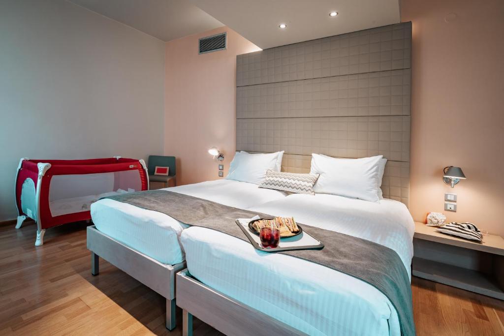 Postel nebo postele na pokoji v ubytování Domotel Olympia