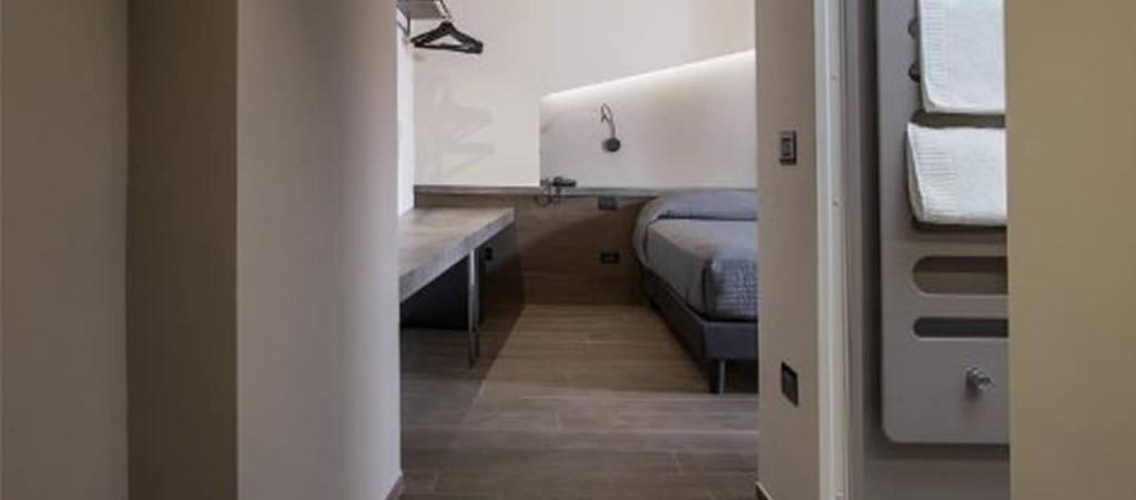 Posteľ alebo postele v izbe v ubytovaní Hotel Dei Nani