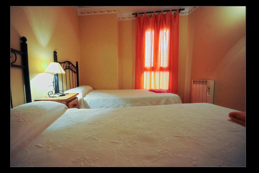 Cama o camas de una habitación en Apartamentos Rurales San Juan