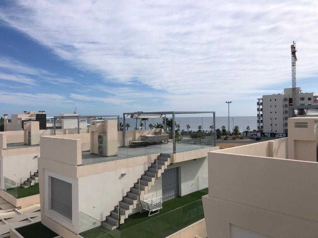 a view from the roof of a building with a view at Modern villa with pool jacuzzi and sea view in La Horadada