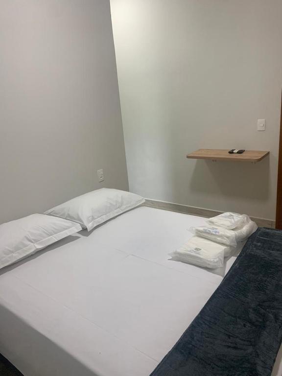 Postel nebo postele na pokoji v ubytování Suites Paraíso de Minas