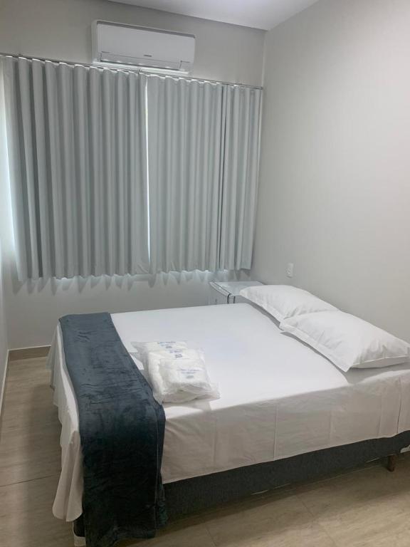 Postel nebo postele na pokoji v ubytování Suites Paraíso de Minas