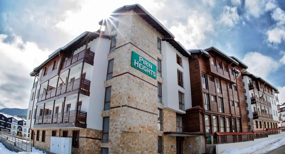 a building with a street sign on the side of it at Double Studio near SKI Lift - Bansko in Bansko