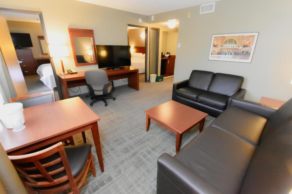 a living room with a couch and a table at Canad Inns Destination Centre Fort Garry in Winnipeg