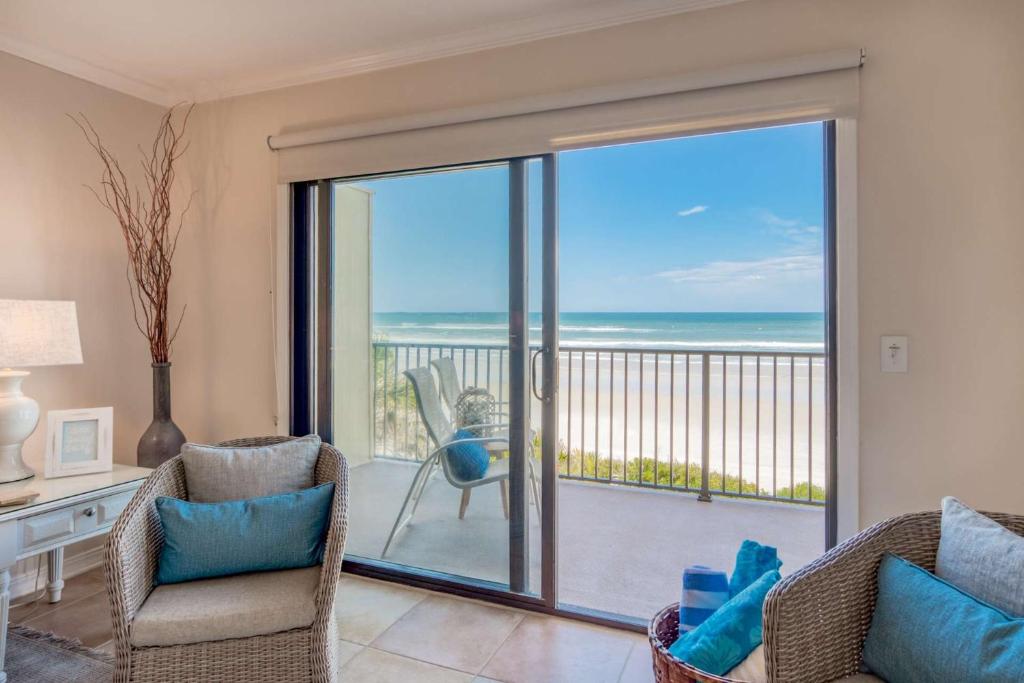 a living room with a view of the ocean at Sunrise Terrace in St. Augustine