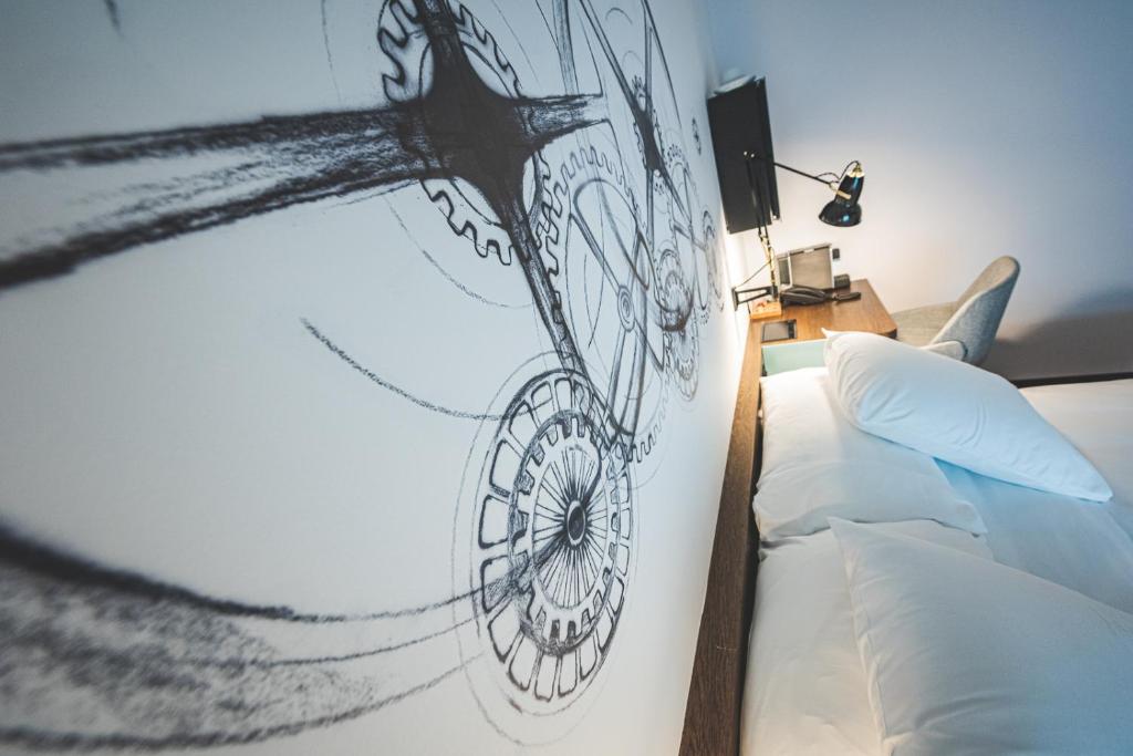 Posteľ alebo postele v izbe v ubytovaní Hotel Bernina Geneva